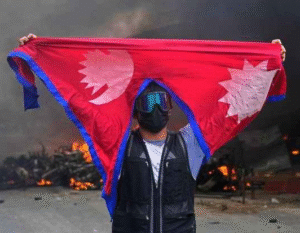Protester holding Nepalese flag proudly